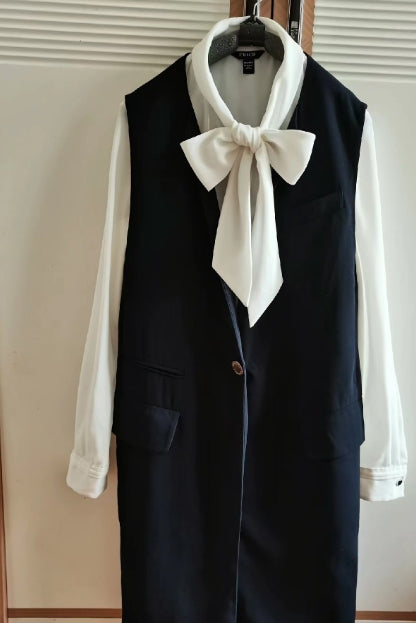 Medium length sleeveless vest in navy blue